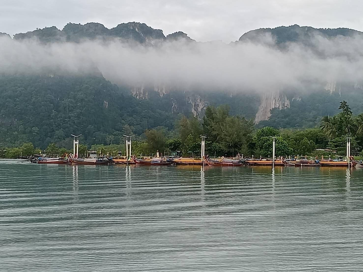 Misty Krabi limestone karsts over the sea